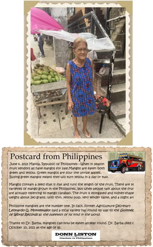 A woman standing in front of some fruit.