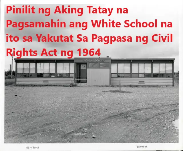 A black and white photo of an old school building.