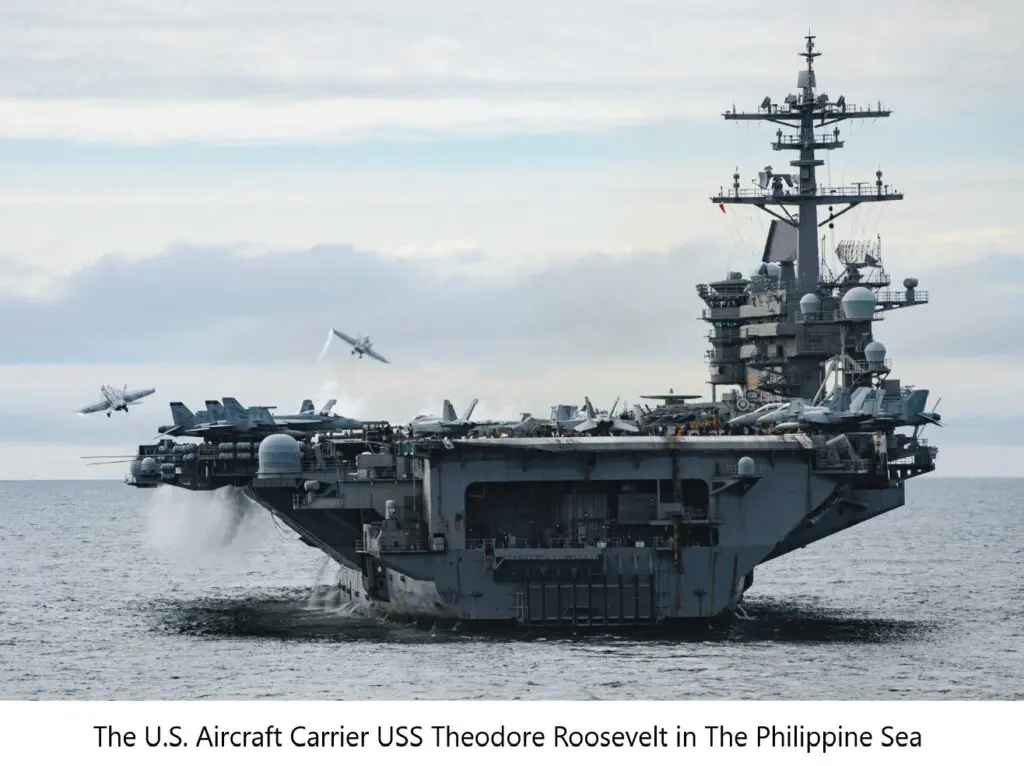 A large aircraft carrier in the ocean with a plane flying overhead.