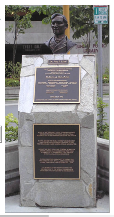 A plaque is on display in front of the building.