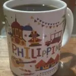 A coffee mug with the word philippines written on it.