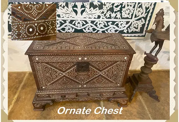 Ornate wooden chest with detailed carvings.