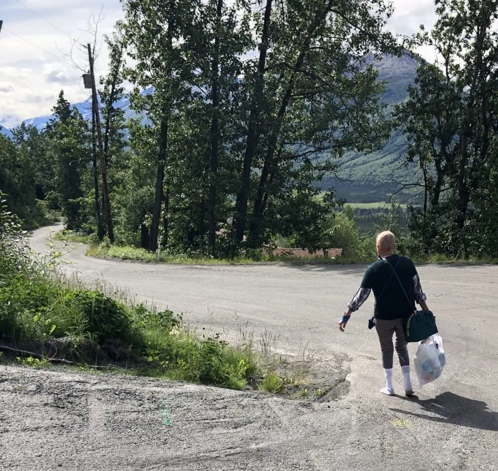 Person walking down a winding road.