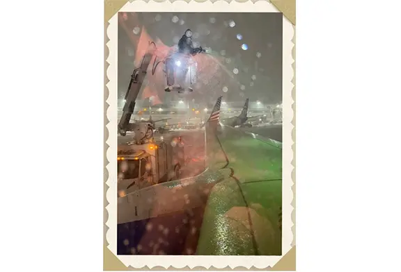 Aircraft wing with de-icing in progress.