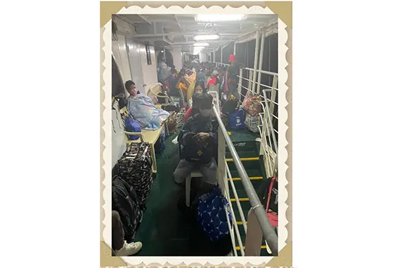 Passengers resting on a ferry.