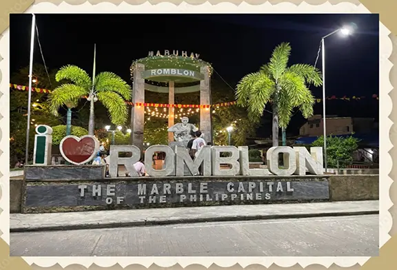 "Welcome sign for Romblon at night."