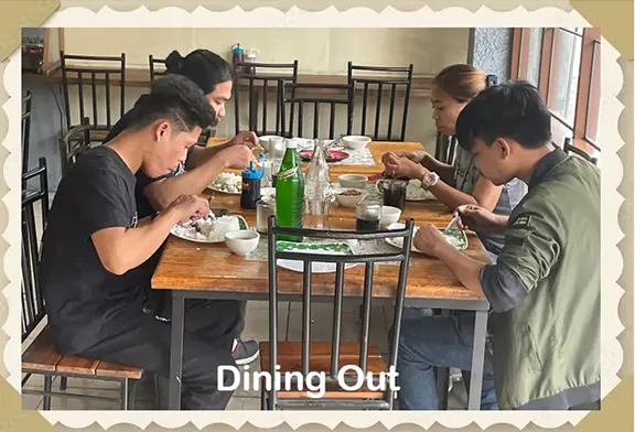 Group enjoying a meal at a restaurant.