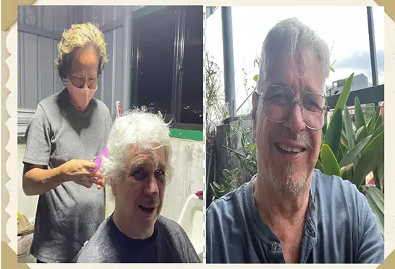 Haircut session with smiling man.