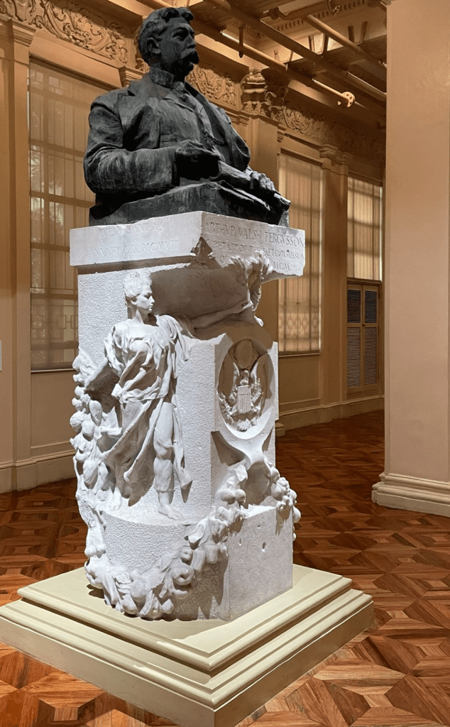 A statue of a bear on top of a pillar.