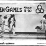 A group of men running in front of a wall.