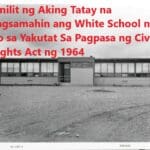 A black and white photo of an old school building.