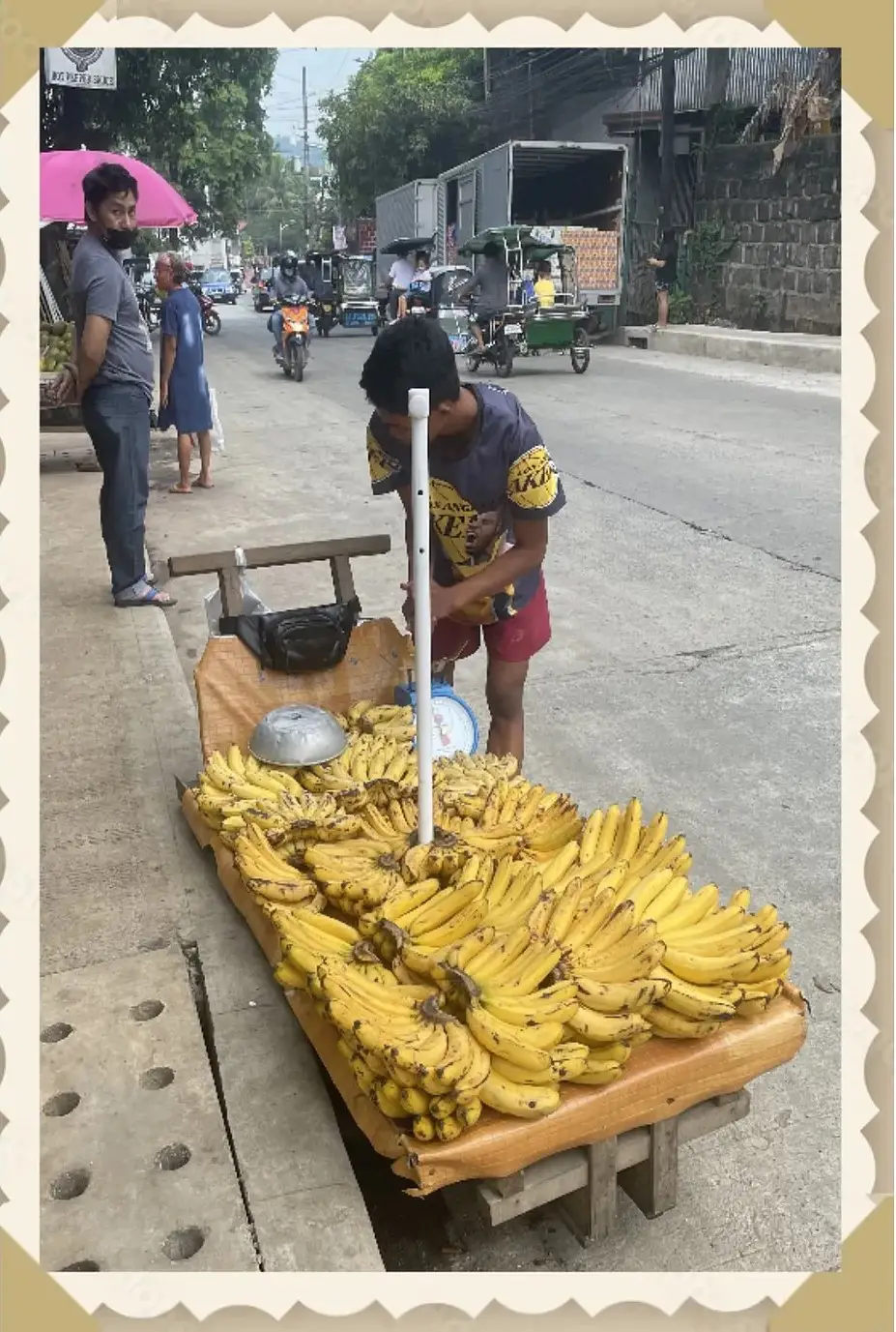 A woman is selling bananas on the street.