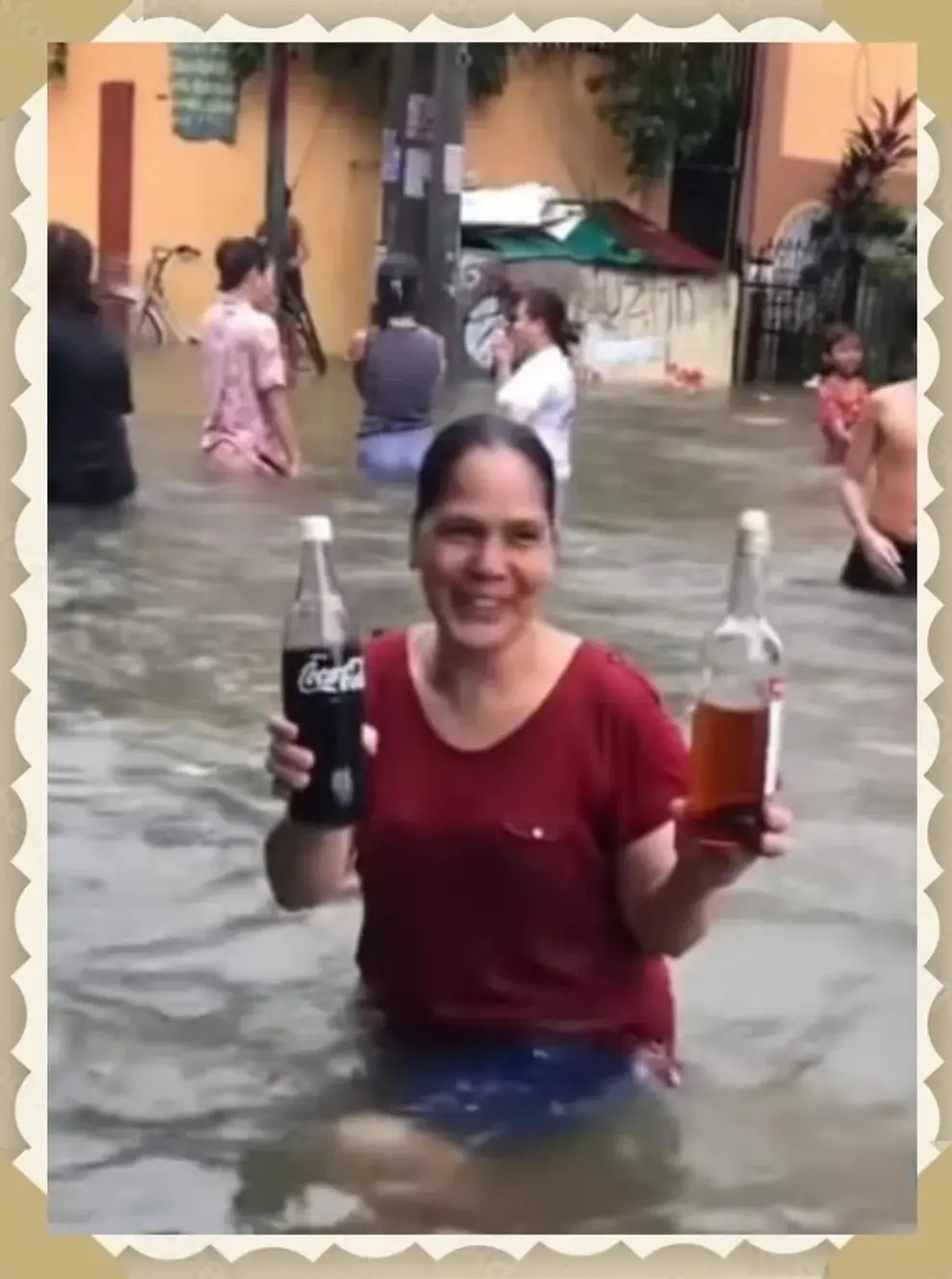 A woman holding two bottles of beer in her hands.